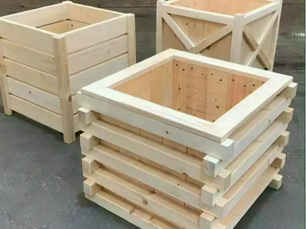 Three square wooden planter boxes